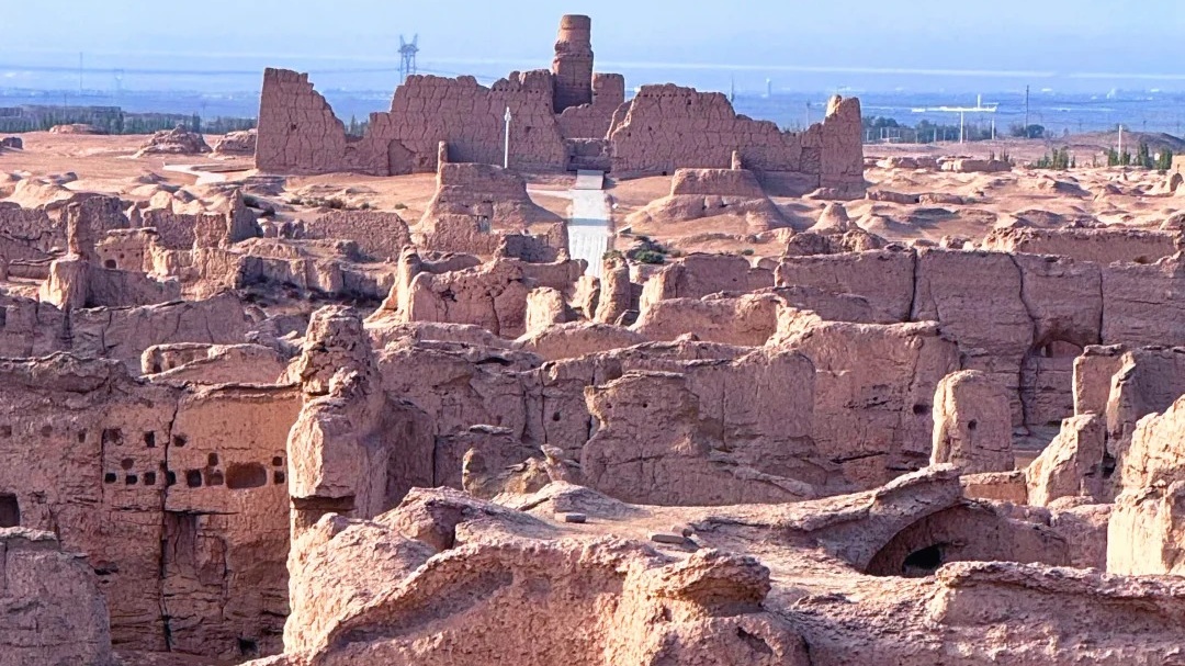 Weathered earth-built ruins and remaining walls across the Jiaohe Ancient City archaeological site near Turpan, Xinjiang, China.